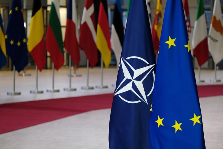 EU Postpones Trade Moves Before NATO Summit - EU plans to postpone trade retaliation, focusing on security talks with Trump before NATO summit in June.
